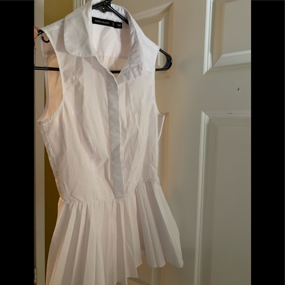 White flawless sleeveless and pleated flared button down by Karen Millen